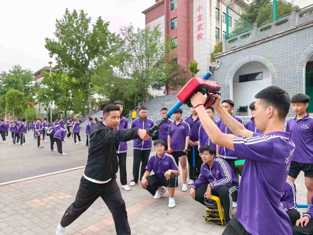image shows Shaolin Kung Fu coach Wu Peng performing kung fu act