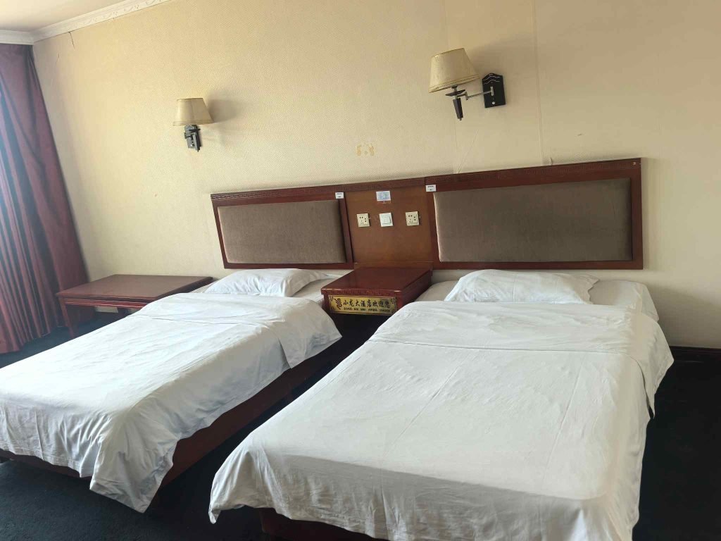 image shows Shaolin Kung Fu School Accommodation and shows two beds