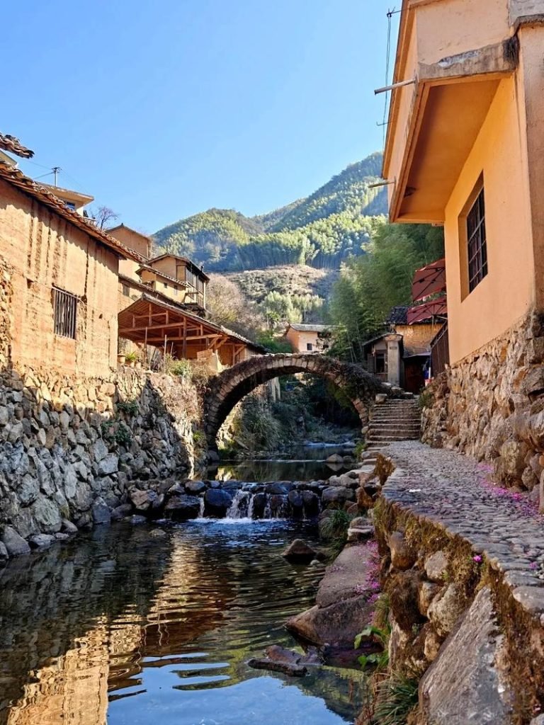Ancient stone bridge over a stream, featured in our complete songyang scenic area travel guide.