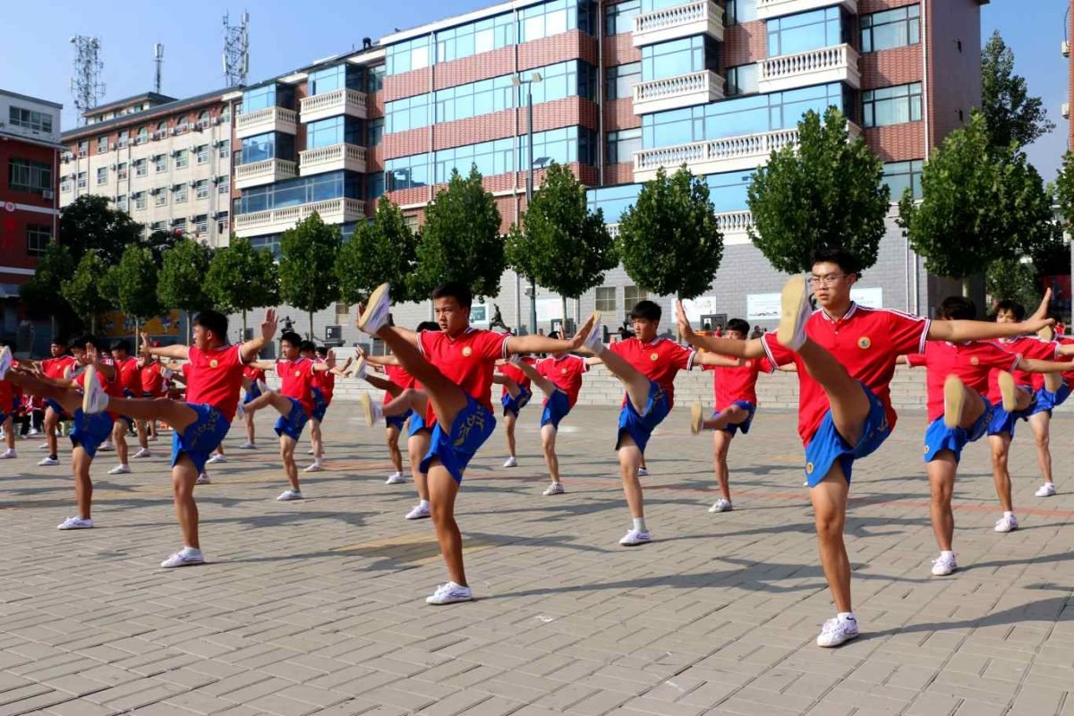 image shows the students doing Shaolin Kung Fu and Tai Chi